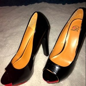 Black patent leather heels with pink and red toe
